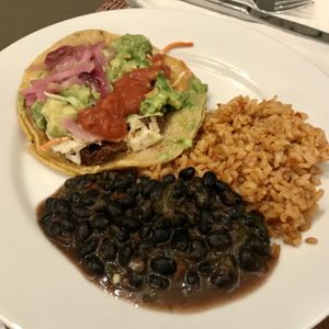 Chipotle carnitas taco with rice and beans at Más Veggies Taqueria in Beaverton