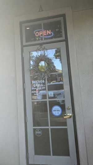 Main entrance has HappyCow sticker on the door at Buenos Grill in Reno