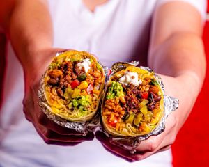 Clocking in at a whopping 1.5lbs, get ready to treat yourself with our new signature Loaded Burrito! It’s filled to the brim with ooey gooey goodness.  at Más Veggies Taqueria in Burbank