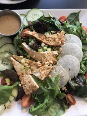 Thai chili peanut salad veganized with a marinated and seared tofu. Housemade peanut dressing. Daikon radishes. This was so good. I could eat it daily   at Eatcetera in Galveston