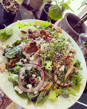 Pear and balsamic salad made with house made balsamic dressing at Rise and Shine Cabaret Cafe in Parkland