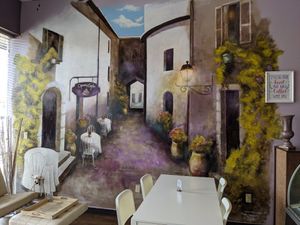 An inviting space but we social distanced at one of the two tables out front. at Opera Café & Coffeehouse in Austin