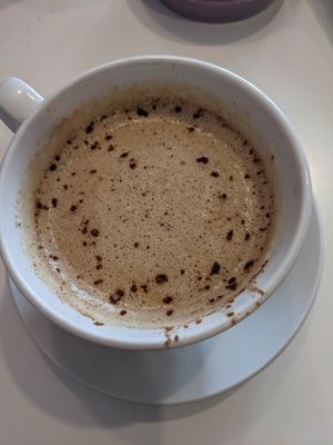 Cappuccino (stirred already) at Opera Café & Coffeehouse in Austin