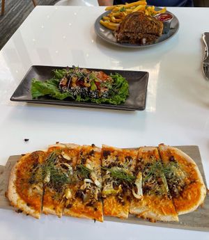 Fennel flatbread, ahi stack, patty melt  at Belse in Dallas