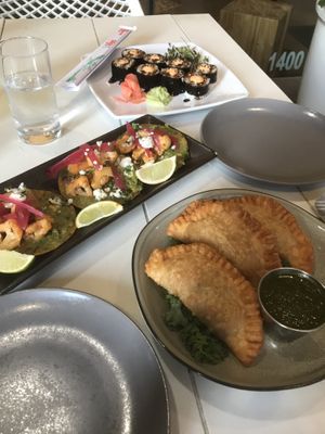 Sweet potato empanadas, cauliflower tostadas and mocki rolls    at Belse in Dallas
