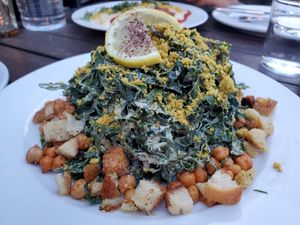 Cesare

Tuscan kale or romaine lettuce, roasted garbanzo, lemon almond dressing, garlic croutons, macadamia parmigiano at Pura Vita in Redondo Beach