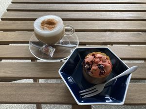 Strawberry muffin and almond milk cappuccino. All drinks can be veganized upon request. at Millow Kitchen in Yokohama