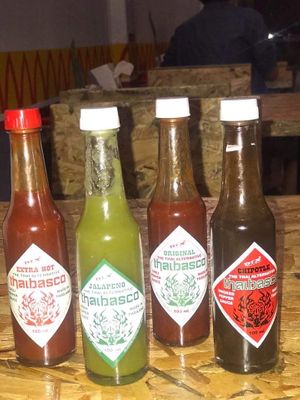 Spicy sauces galore (love the smoky one)! at COCO Burrito Box in Chiang Mai