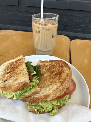 Avocado toastie with the lot and iced soy latte   at Soul Sisters Café in Camberwell