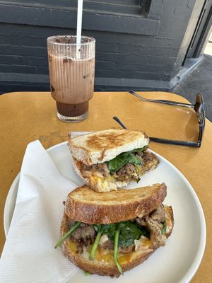 Mushroom meatball toastie and almond milk iced mochaa  at Soul Sisters Café in Camberwell