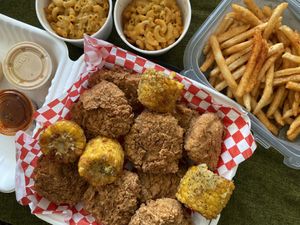 Family chicken bucket with Cajun fries and mac&cheese   at Don't be Chick'n in San Jose