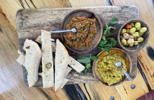 Olives, bread and zucchini and couscous pesto   at Rainarai in Rotterdam