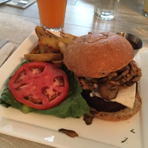 Seitan & mushroom burger (with vegan mozzarella) and truffle potato fries at Candle Cafe in New York City