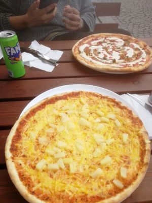 A vegan pineapple pizza and vegetarian kebab pizza with ajvar sauce.  at Tre Vänner Pizzeria in Oskarshamn