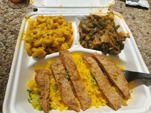 Chicken platter with rice, collards, and mac + cheese at Pure Soul in Durham