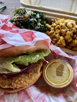 The chicken sandwich platter with kale salad and mac at Pure Soul in Durham