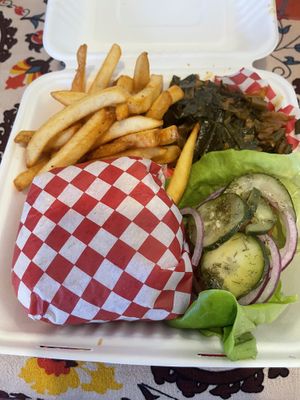 Chicken sandwich plate w/collards, fries and goodness 😋  at Pure Soul in Durham