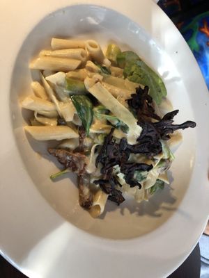 Cashew lemon pasta (gluten free) : asparagus, artichoke, sun-dried tomato, capers, shiitake bacon, served with gluten free  at Caravan of Dreams in New York City