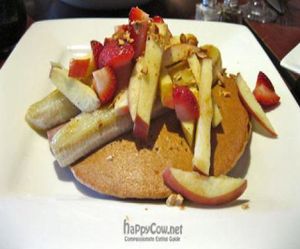 Berry Pancakes with Two spelt pancakes, grilled banana, fresh fruit, chopped nuts. at Caravan of Dreams in New York City