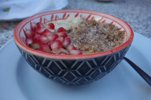 Vegan rice pudding with various nuts and pomegranate seeds at Morsch's Imbiss in Saarbrucken