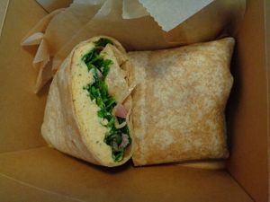 Herbed Hummus Wrap.  housemade roasted garlic + herb hummus, arugula, pickled onion, lemon vinaigrette  at Chardon Buckeye Chocolate Café in Chardon