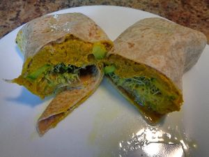 Sweet Potato Hummus Wrap. Sweet potato hummus, roasted shallots, cucumber, sprouts, lemon vinaigrette. Filling and lots of napkins recommended.  at Chardon Buckeye Chocolate Café in Chardon