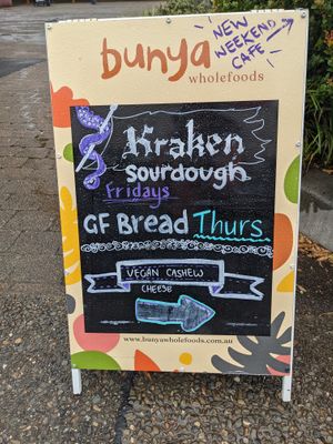 This is the only indication that the shop is there, this sign in the main pedestrian area of the shops - it is tucked at the back. at Bunya Wholefoods in Vincentia