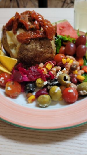 Baked potato with hummus & sun dried tomatoes at Cafe U in Kelso