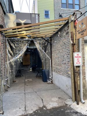 Back ally entrance, no reason to go inside if you don’t want to or don’t feel comfortable  at Pizza Friendly Pizza in Chicago