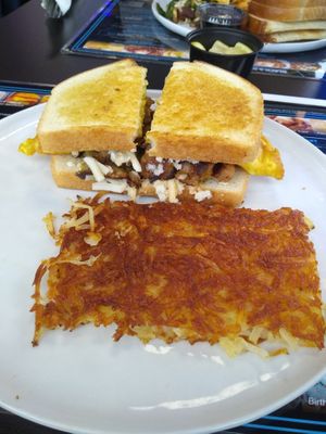 Breakfast sandwich with hash browns  at Black & Blue Diner in Las Vegas