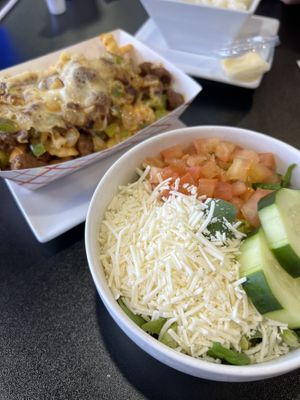 Side salad and loaded vegan fries.  at Black & Blue Diner in Las Vegas