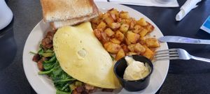 Omelette with steak, home fries and toast + butter at Black & Blue Diner in Las Vegas
