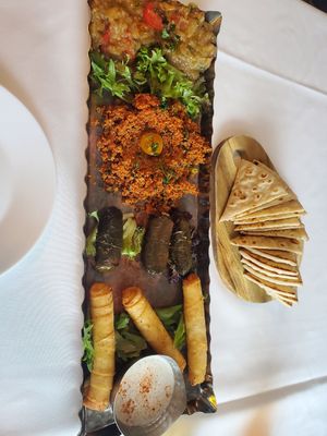 Tapas from top: Babaganoush, tabouli, dolmas, feta rolls with tazicki at Red Onion Organic in Destin