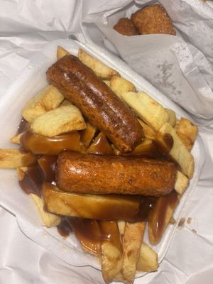 Chips and gravy with 2 sausage   at Milton Chippy in Stoke-on-trent