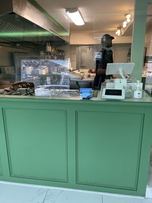 Chef cooking at Greens N Teff in Arlington