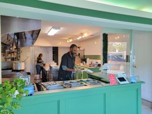 Food counter at Greens N Teff in Arlington