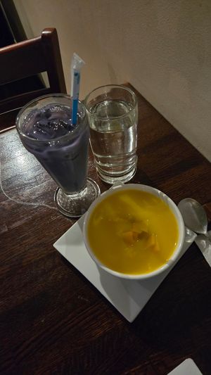 Ube drink and pumpkin "porridge" (was giving soup) at Franchia Vegan Cafe in New York City
