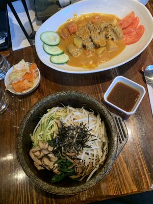 Complimentary kimchi, Classic stone bowl, “Beef” in spicy coconut sauce 😋  at Franchia Vegan Cafe in New York City