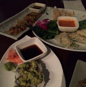 scallion pancakes, steamed dumplings, and guacamole sushi at Franchia Vegan Cafe in New York City