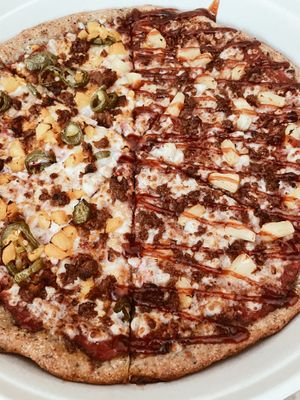 Half Georgia peach / half Hawaiian plant-based pizza  at Plant Based Pizzeria in Sandy Springs