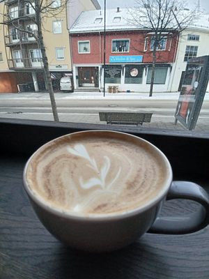 Latte with view on the street at Maloca Coffee & Food in Bodo
