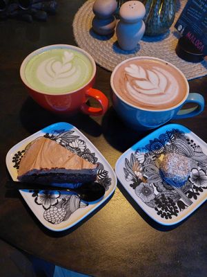 Vegan Matcha latte, vegan hot chocolate, chocolate cake and coconut ball at Maloca Coffee & Food in Bodo