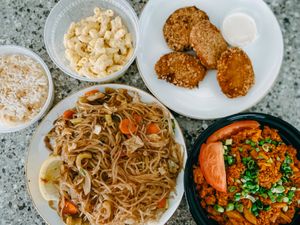 Pencil, corned beef, crab cakes, macaroni salad and garlic rice at Chef Reina in Brisbane