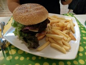 veggeie burger with potatoes at Loving Hut in Madrid