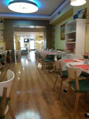 Restaurant seating at Loving Hut in Madrid