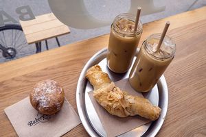 Berliner, almond croissand and iced coffee at Bakery Bakery - Länggasse in Bern