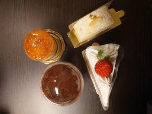 Soleil (upper left), Lemon Roll Cake (upper right), Tiramisu (lower left), and Strawberry Shortcake (lower right)  at Marbre Vegan in Tokyo