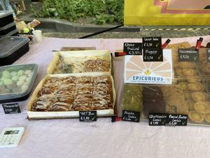Great vegan bakery! Try their pastel de nata, forest fruit crumble, carrot cake, many croissants, macaroons and veggie roll! at Rotterdamse Oogstmarkt in Rotterdam