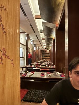 sitting on mats without our shoes on  at HanGawi in New York City