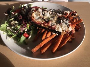 Eggplant Parma with vegan ‘Follow Your Heart’ cheese, sweet potato fries and salad at Port Campbell Hotel in Port Campbell